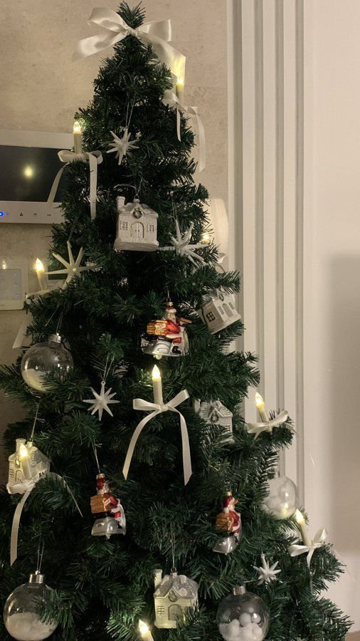 a small christmas tree with ornaments on it