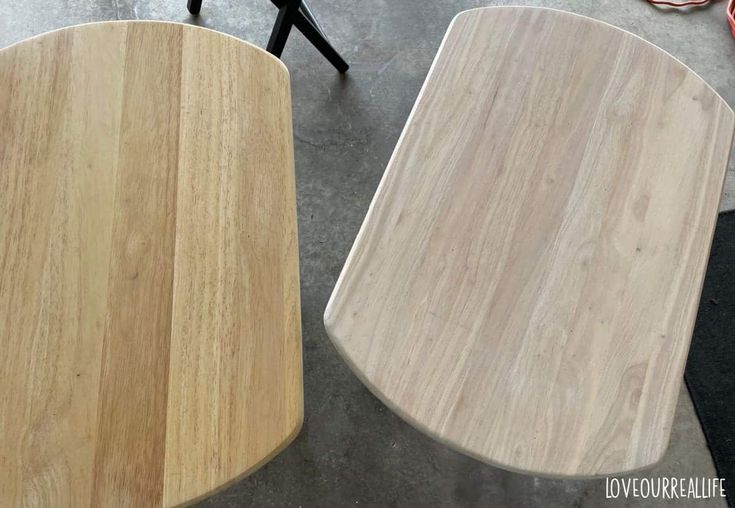 two wooden tables sitting next to each other