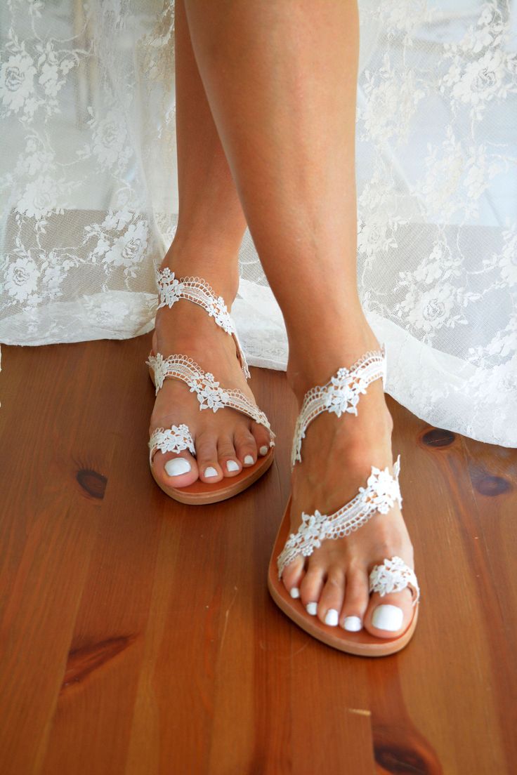 "#PLEASE LEAVE YOUR CONTACT NUMBER UPON CHECK OUT# CHOOSE DHL EXPRESS - 1-4 DAYS DELIVERY - EU ESTIMATED TIME: 1-2 DAYS WITH DHL EXPRESS SHIPPING - USA & NON EU ESTIMATED TIME: 2-4 DAYS Handmade to order leather sandals 'Cherish ||'-Handcrafted in Greece -For our entire collection of wedding sandals, please visit: https://www.etsy.com/shop/LovelyBrideByAnna Our romantic leather sandals 'Cherish'. Hand decorated with a beautiful French flowerlace. They compliment the foot offering an elegant Sandals For Bride, Wedding Flats For Bride, White Lace Shoes, Wedding Sandals For Bride, Bride Flower, Sandals Wedding, Lace Sandals, Embellished Shoes, Crystal Sandals