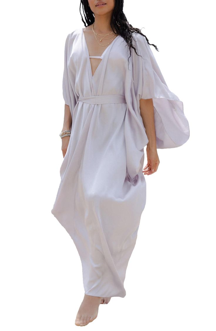 Perfect for poolside hangs or kicking it in the sand, this tie-front kaftan is the perfect accessory to add to your sun-loving wardrobe. V-neck
 Short sleeves 100% polyester satin Hand wash, line dry
 Imported Model stats: 5'10", 32" bust, 25" waist, 36" hip. Model is wearing size One Size. Flowy V-neck Kaftan For Day Out, Bohemian V-neck Tie Waist Cover-up, Chic Summer Wrap Cover-up, Chic Spring Unlined Cover-up, Chic Unlined Spring Cover-up, Flowy V-neck Kimono For Day Out, Chic V-neck Summer Kimono, Chic V-neck Kimono For Daywear, V-neck Summer Kaftan For Vacation