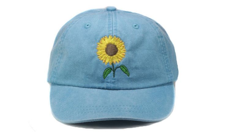 Sunflower embroidered on a pigment dyed cap in choice of color. Shown on carribean, navy(light), and charcoal Colors may not look the same on all monitors Adams brand 100% garment-washed cotton twill 6-panel, unstructured, low-profile tuck-away back leather strap with antiqued brass buckle and grommet adjustable. fits men or women Cool-Crown™ mesh lining four rows of stitching on bill Garment washed, pigment dyed gives the cap a nice faded look Carribean Colors, Sunflower Hat, Fall Hat, Gardening Hat, Periwinkle Color, Floral Hat, Fall Hats, Flower Gardening, Fits Men