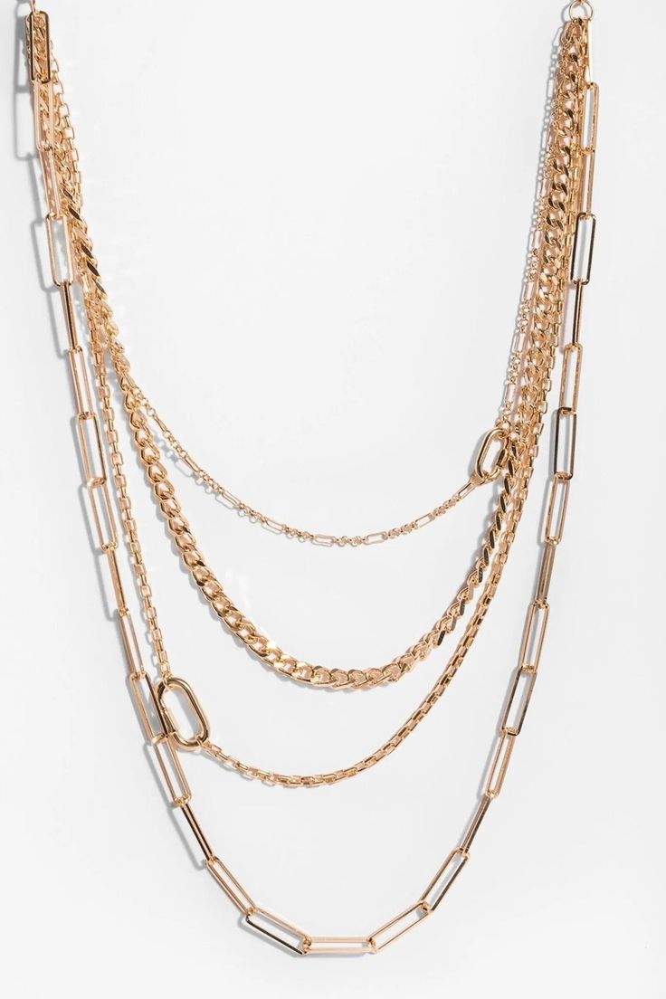 We absolutely adore a modern chain! Our Layered Gold Chain Multi Necklace features four gold link chains stacked together for a trendy look. Pair with your favorite gold accessories for an elegant ensemble, or dress up classic jeans and a tee. Materials: Iron Chain, Zinc Alloy Size: Shortest Chain-16", Longest Chain-26" Lobster Clasp Imported Trendy Layered Chain Link Necklace, Trendy Chain Link Layered Necklace, Trendy Layered Necklace With Double Chain Link, Trendy Link Chain Necklace For Layering, Trendy Multi-strand Layered Chain Necklace, Chic Double Chain Necklace, Trendy Chunky Chain Layered Necklace, Trendy Layered Necklace With Chunky Chain, Chic Delicate Chain Necklace In Metal