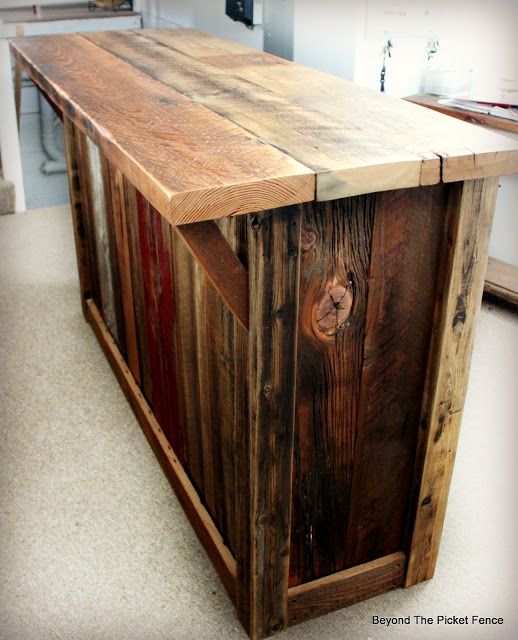 a kitchen island made out of pallet wood