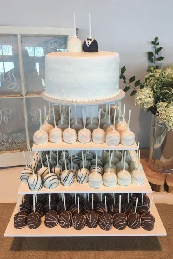 a wedding cake and some chocolate covered desserts