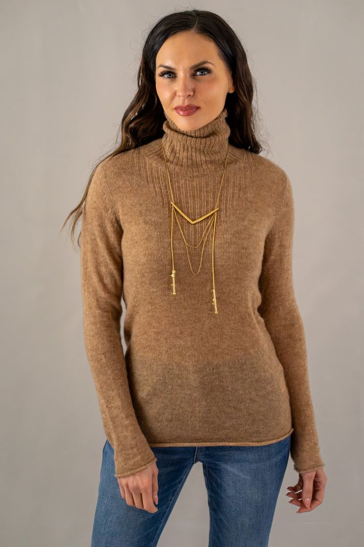 Elevate your cold-weather collection with our slim fit heathered turtleneck sweater, a harmonious blend of comfort and style. This camel textured knit top features subtle color flecks, adding depth to the classic design. With its sophisticated high neckline and versatile appeal, this sweater is an essential piece for layering or as a standalone statement. 

60% Baby Alpaca
5% Merino Wool
35% Polyamide
Made in Peru

DRY CLEAN Chic Textured Knit Turtleneck, Elegant Textured Knit Turtleneck For Fall, Classic Textured Knit Turtleneck For Fall, Elegant Textured Knit Turtleneck For Winter, Turtleneck For Layering, Elegant Textured Knit Long Sleeve Turtleneck, Elegant Long Sleeve Textured Knit Turtleneck, Chic Cashmere Turtleneck For Fall, Elegant Cable Knit Turtleneck Sweater