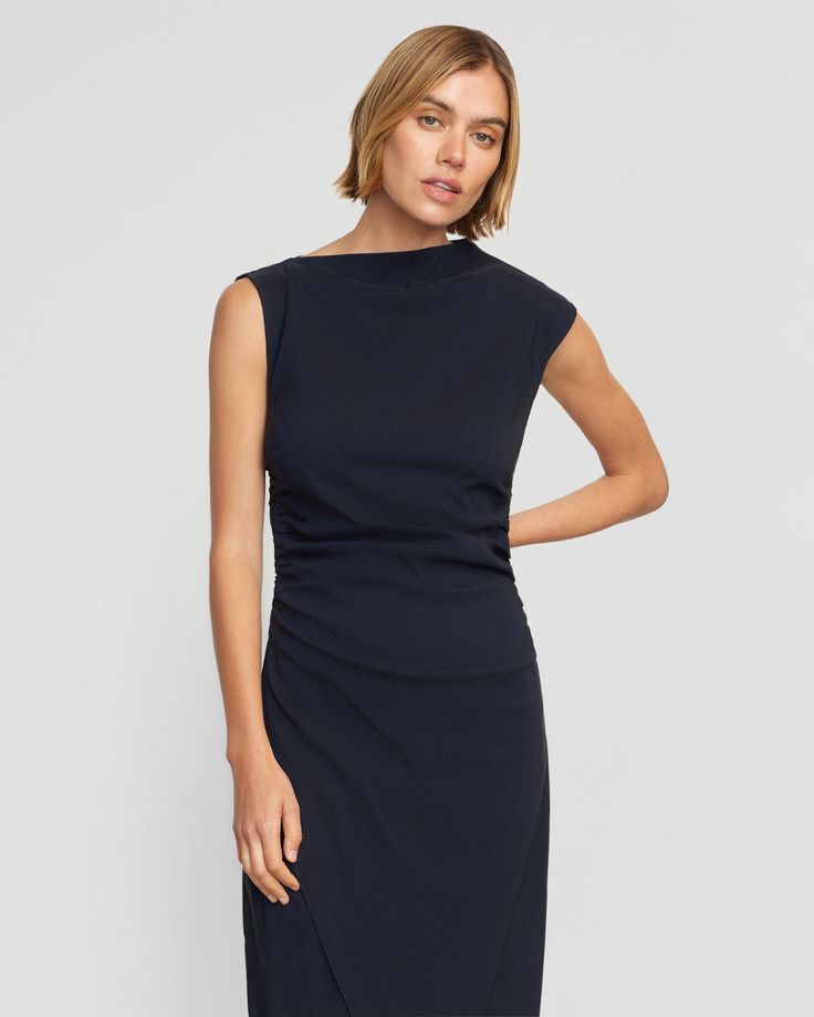 The elevated midi dress is a wardrobe must-have — Manon exudes effortless polish with its asymmetric neckline, ruched sides, and wrap front. We love to style it with a sleek pair of heeled boots for a desk-to-drinks look. See below for our general Size Guide and available measurements Made of 73% rayon, 23% nylon, and 4% spandex Machine wash cold and lay flat to dry Bodycon Mini Dress With Ruched Detail And Asymmetrical Neckline, Black Midi Dress With Asymmetrical Neckline And Ruched Detail, Fitted Black Asymmetrical Dress With Ruched Details, Blue Asymmetrical Neckline Stretch Bodycon Dress, Black Mini Dress With Ruched Detail And Asymmetrical Neckline, Modern Dress, Ruched Dress, Clothing Essentials, Modern Outfits