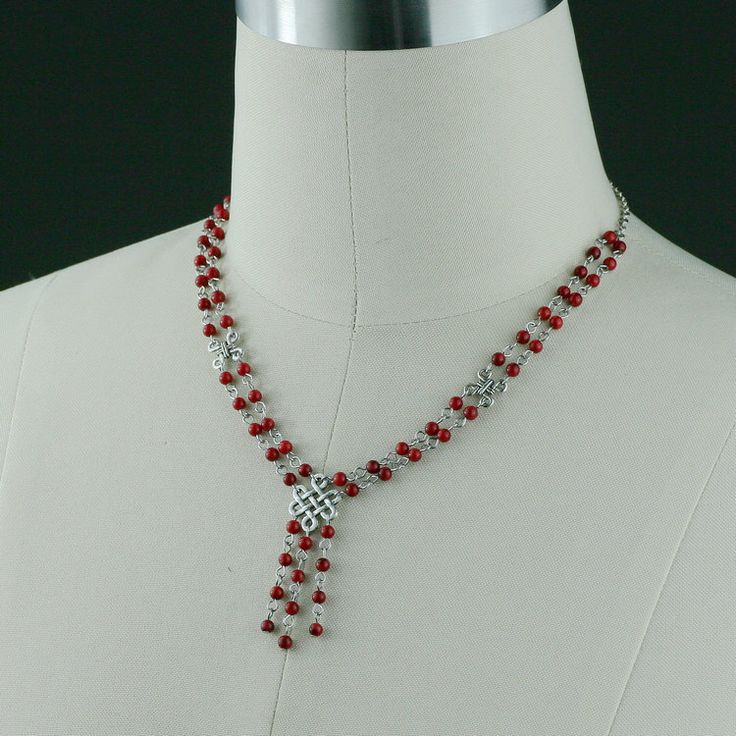 This double stand necklace is handmade using coral; Coral red, a powerful and bold color that captures the viewer's attention. One's eye will always gravitate to where the red is. The length of the necklace is 20-23 inches, or 50-58 cm. It is well suited to crew and high necklines, but can equally add a frame to a plunging neckline. This length looks great with a tailored jacket. The V-shape lariat elongates our neckline and siphones attention to our face. It is easy to wear, it is comfortable t Elegant Red Long Beaded Necklace, Elegant Long Red Beaded Necklace, Red Long Necklace For Party, Red Long Necklace Jewelry For Gifts, Elegant Long Red Necklace, Red Dangle Necklaces For Party, Elegant Crystal Necklaces For Valentine's Day Gift, Adjustable Bridal Necklace As Gift, Adjustable Bridal Necklace Gift