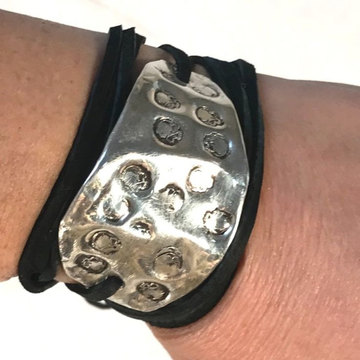 Thank You For Looking At This One Of A Kind Handmade Cuff Bracelet That I Designed It Is Created From Antique Sterling From The Art Deco Era, About 100 Years Old! Repurposed This Sterling From An Antique .Tested Sterling Stamped With A Skull Stamp About 8 Grams Please Allow For Slight Difference, As I Am Using Antique Silver And Each Piece Is A Slightly Different Weight And Size 1.25 Inch X 2.5" Genuine Suede Leather Tying The Leather Is Easy You Can Use A Combination Of A Slipknot And A Normal Adjustable Black Oxidized Bracelet, Adjustable Silver Cuff Bracelet For Festival, Punk Style Nickel Free Silver Bracelet, Silver Adjustable Cuff Bracelet For Everyday, Adjustable Silver Cuff Bracelet For Everyday, Silver Punk Cuff Bracelet For Festival, Adjustable Black Nickel-free Cuff Bracelet, Punk Style Silver Cuff Bracelet For Festival, Adjustable Silver Leather Bracelet