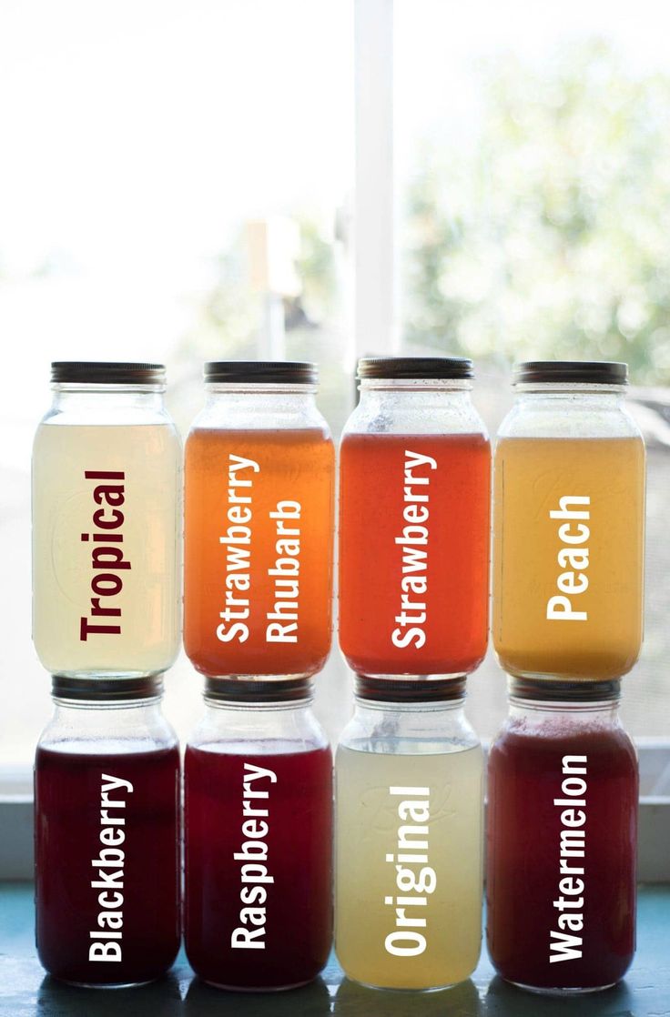 six jars filled with different types of liquid