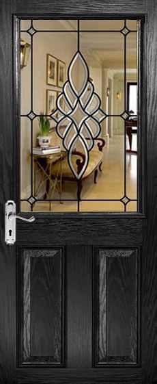 a black door with a glass paneled design on the front and side panels that lead to a dining room