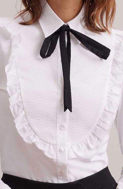 The MANUSCRIT is the perfect white shirt to complete your look. Featuring a large textured bib detail that is framed with a single ruffle. The classic collar, button placket and French cuffs that allow for cufflinks are cotton voile. The MANUSCRIT is finished with a removable black string. Style Nr H22F008 The shirt comes with a removable black string Body: 92% Cotton, 8% Elastane; Collar, Cuffs, Bib, Ruffle, Button Tab, Collar Tie: 100% Cotton Jersey cotton is a stretch knit made of cotton and The Perfect White Shirt, Fashion Library, Perfect White Shirt, Bib Collar, Modern Victorian, Cotton Voile, Fitted Silhouette, Button Placket, White Shirt