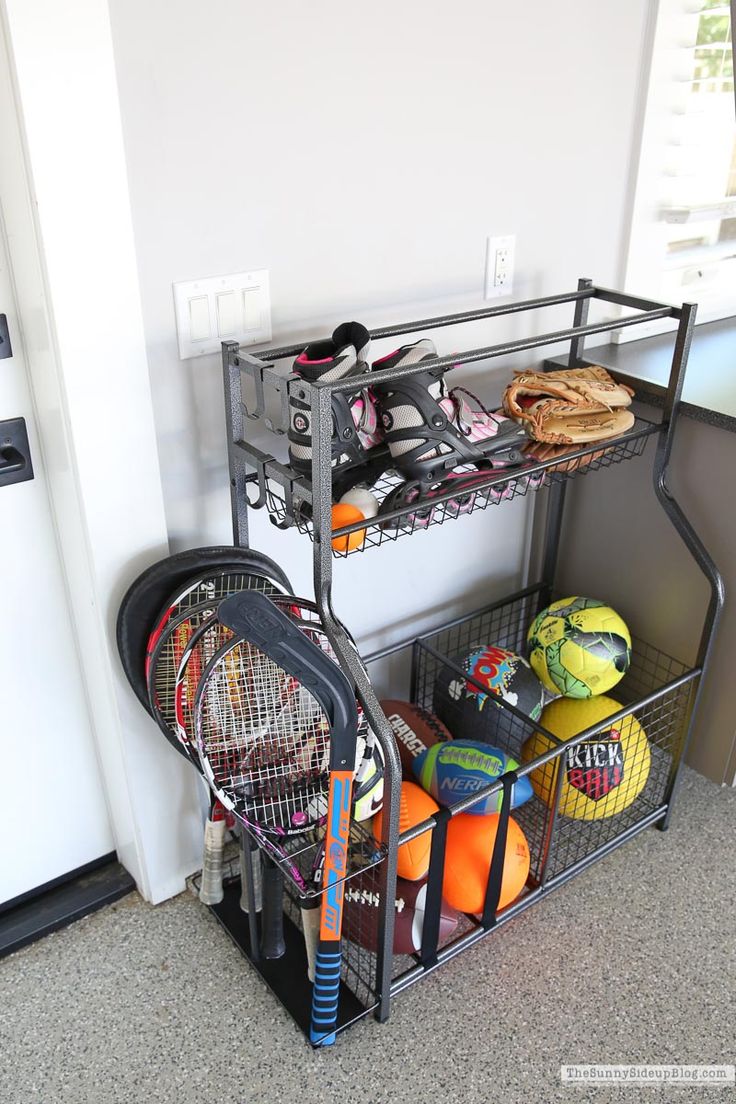 there is a rack with tennis gear in it