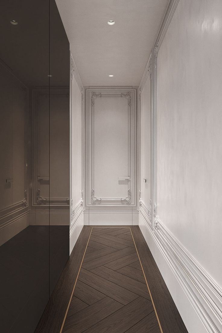 an empty room with white walls and wood flooring is shown in this image, there are no people