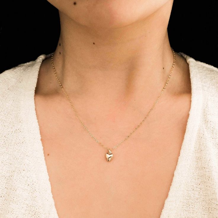 The Tiny Heart Necklace is the sweetest addition to any collection. Dainty yet durable, this necklace is ready for everyday wear, so you can feel the love on any occasion - date night, brunch with friends, or a coffee run by yourself! It also makes a precious gift for someone special to you. DETAILS Necklace length: 16" with 2" extender 14k gold filled charm, jump ring, & findings 8mm heart charm Dainty Everyday Birthstone Necklace With Delicate Chain, Dainty Everyday Birthstone Necklace With Initial Pendant, Everyday Dainty Birthstone Necklace With Initial Pendant, Minimalist Everyday Necklace With Heart Charm, Simple Everyday Heart Charm Necklace, Dainty Everyday Birthstone Necklace, Minimalist Everyday Charm Necklace With Heart, Dainty Heart Pendant Birthstone Necklace, Simple Everyday Charm Necklace With Heart