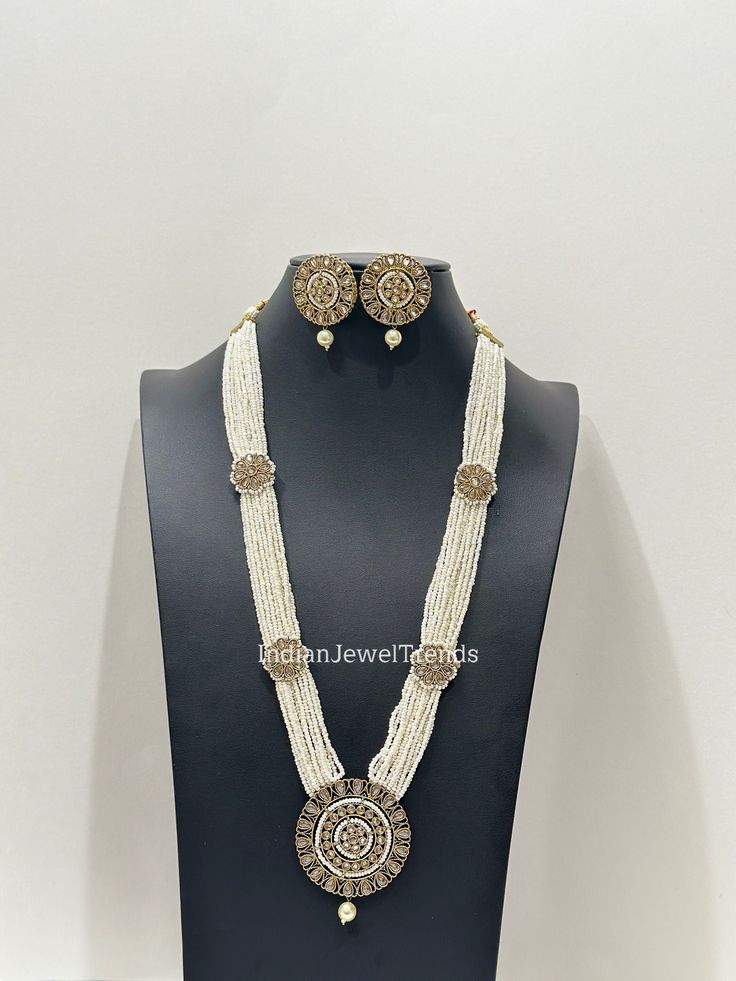 White Pearl Long Antique Polki Necklace/Indian Long Necklace/Pakistani Jewelry/Necklace Mala/Indian/Punjabi Jewelry/Indian Wedding/Rani Haar Reverse Ad Stone Necklace Regular Size And Adjustable handmade chord Dori Handmade Design Antique Necklace Set Dispatch in 1 Business Day  Ships from California USA This is 100% Handmade jewelry. So Color, shades, texture displayed may slightly vary from the actual product due to digital image limitations. We request you to consider these minor variations. Please expect the possibility of some slight imperfections when buying handmade jewelry. If you have any questions, please message or email us. Arrives in a gift box. Please let me know if you have any questions. Thank you so much visiting my shop. Traditional Round Necklaces For Eid, Luxury White Temple Necklace For Ceremonial Occasion, Traditional White Kundan Necklace For Eid, Traditional Round Pearl Necklace For Diwali, Traditional Long Necklace For Wedding Festivals, Heavy White Necklaces For Ceremonial Occasions, White Kundan Necklace With Cutdana For Eid, Traditional Heavy Pearl Necklace For Festive, Traditional Pearl Necklace For Festivals And Celebrations