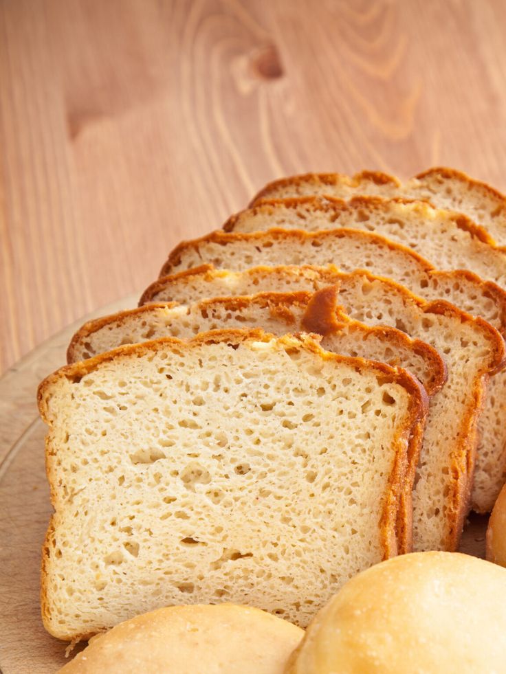 slices of bread and rolls on a plate