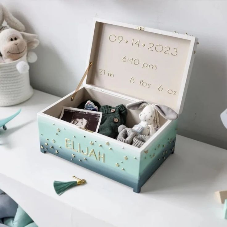 a baby's birth gift box filled with toys