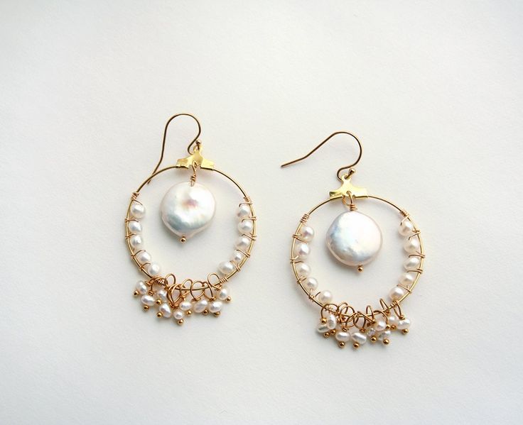 Coin Pearl Earrings, Bohemian Wedding Earrings, Boho Bride, Pearl Earrings It's all about the round hoops and round pearls in this bohemian bridal earring. Wear on your wedding day and after. Because these will look great for brunch too! + Coin Pearl. Small pearls. 14K Gold Fill Ear Wire. 14K Gold Fill Hoop. + Length: 2 inches. + Width: 1.25 inches at the widest part. + Earrings are ready to ship. + Your jewelry will come in a jewelry box, tied with a ribbon. Thanks for looking ♥ Check out our o Bohemian Pearl Pendant Jewelry, Handmade Small Hoop Pearl Earrings For Wedding, Handmade Pearl Hoop Earrings For Weddings, Wire Wrapped Dangle Hoop Earrings For Wedding, Round Hoop Earrings With Pearl Charm For Wedding, Bohemian Hoop Earrings With Ear Wire For Wedding, Wire Wrapped Hoop Jewelry For Wedding, Gold Hoop Earrings With Dangling Beads For Wedding, Small Pearl Hoop Earrings For Wedding