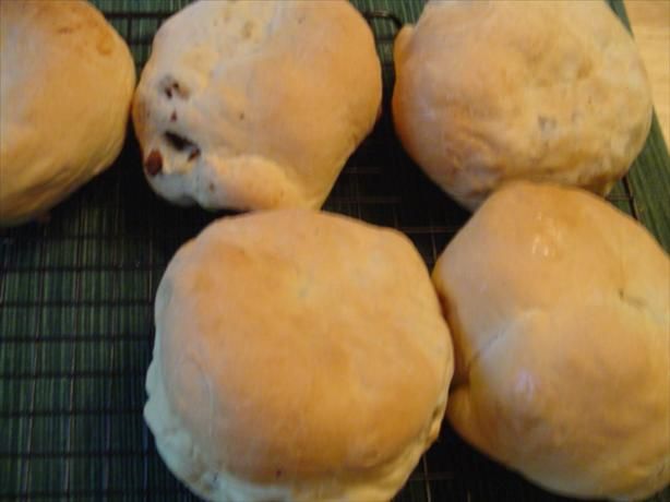 four rolls sitting on top of a cooling rack