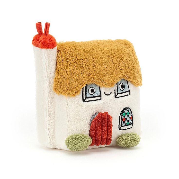 a small white house with a brown roof and red trim on the front, made out of felt