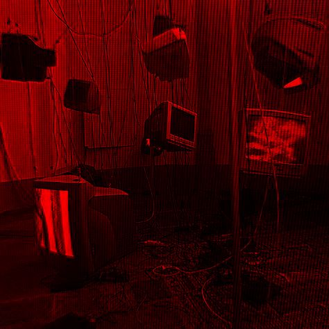 a room with red lights and several televisions on the wall