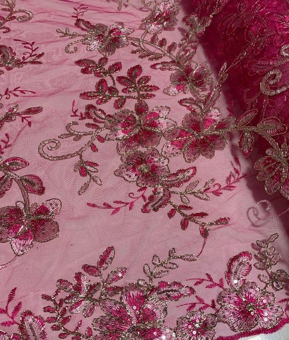 pink and gold embroidered fabric with sequins