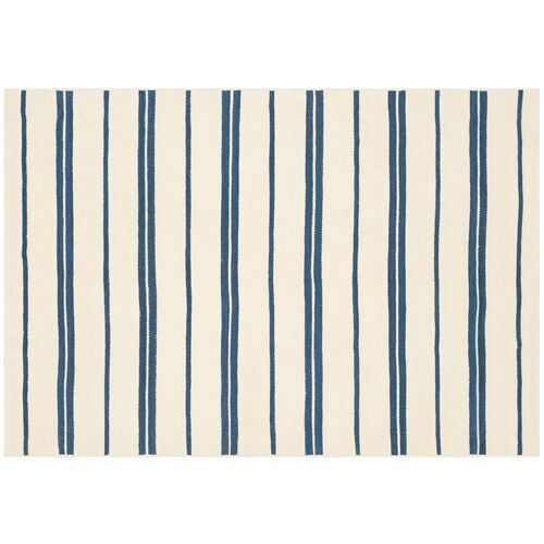 a blue and white striped rug on a white background with vertical lines in the middle