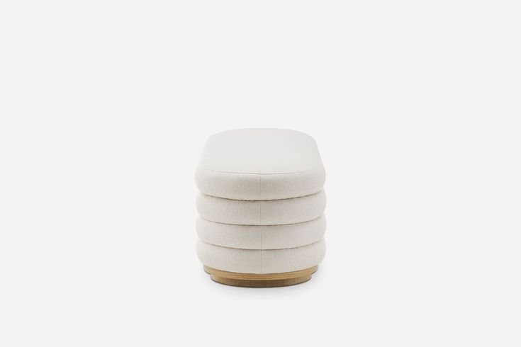 four white stools stacked on top of each other