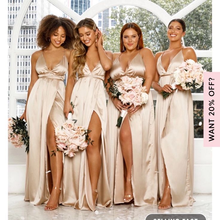 a group of women standing next to each other wearing dresses and holding bouquets in their hands