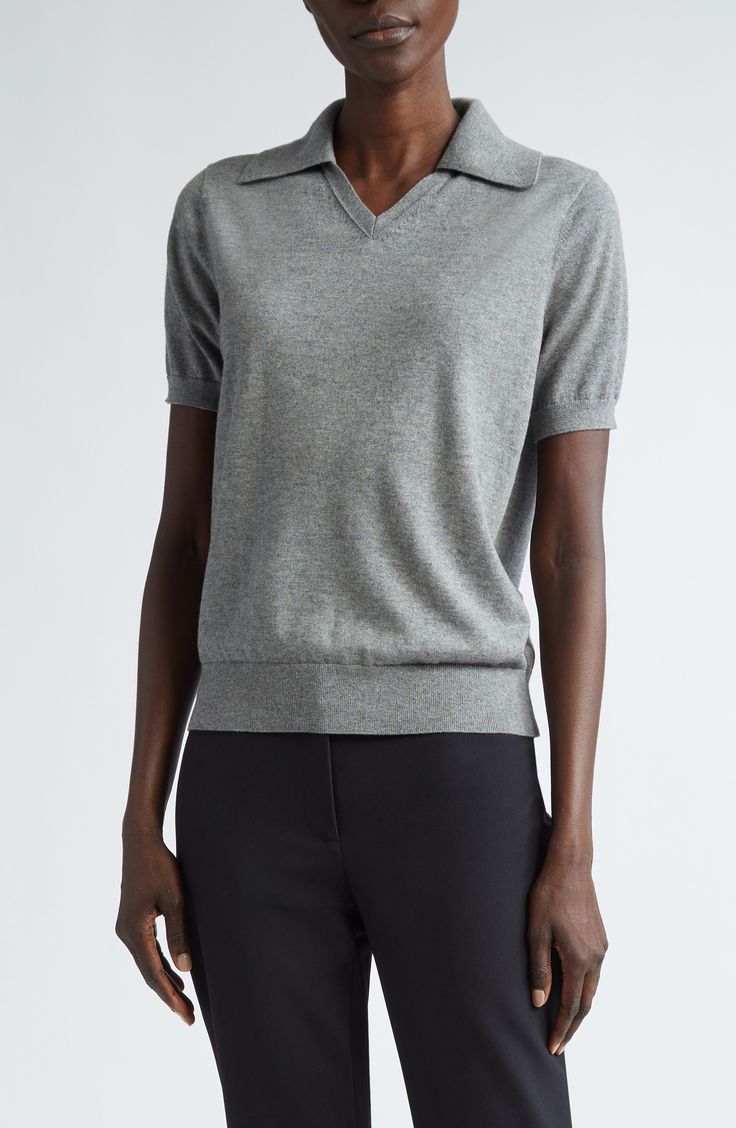 Luxuriously soft cashmere and silk yarns nod to the NYC-based label's focus on impeccable materials in a polo-style sweater topped with a wide johnny collar. 22" length (size medium) Johnny collar Short sleeves Ribbed cuffs and hem 70% cashmere, 30% silk Dry clean Imported Designer Clothing Classic Fitted V-neck Polo Sweater, Fitted Cashmere Polo Sweater In Fine Knit, Fitted Cashmere Polo Sweater With Fine Knit, Fitted Fine Knit Cashmere Polo Sweater, Luxury Fitted Cashmere Tops, Formal Fine Knit Cashmere Tops, Fitted Cashmere Top For Business Casual, Formal Merino Wool Fine Knit Top, Classic Gray Formal Tops