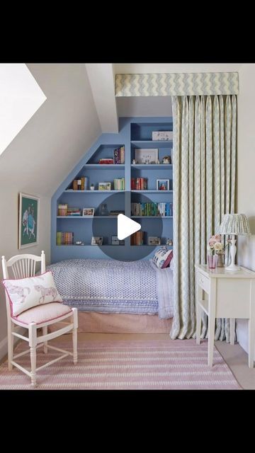 an attic bedroom with blue shelves and white furniture