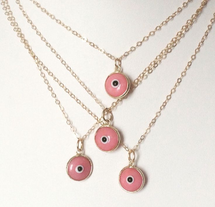 Evil Eye Pink Necklace. I love Evil Eye Jewelry. It is believed to keep its wearer safe from evil and negative people, and avert what is considered the evil eye. The charm is pink and sits beautifully on a gold filled cable chain. Personalize this necklace by choosing what length chain you want...a limit of 24 inches is listed in the drop down menu. 🧿 🧿 🧿 Pink Evil Eye Spiritual Jewelry, Pink Spiritual Jewelry With Evil Eye, Pink Spiritual Evil Eye Jewelry, Layered Necklaces Boho, Pink Beanie, Glass Evil Eye, Word Necklace, Necklace Evil Eye, Red Beaded Necklaces