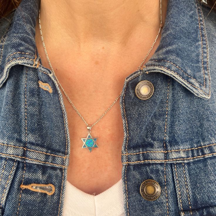 "A beautiful Star is of David with Opal made in 925 Sterling Silver. A beautiful piece to add to your collection or to give as a special gift. This piece of jewelry comes wrapped in a nice package and is ready to be given as a gift. ❤ 𝗠𝗘𝗔𝗦𝗨𝗥𝗘𝗠𝗘𝗡𝗧𝗦 ❤ Pendant height: 0.59\"/ 1.5 cm Please choose your preferred length from the list above. ❤ 𝗠𝗬 𝗦𝗧𝗢𝗥𝗘 ❤ Feel free to take a look at my shop (below) for more beautiful items and inspiration For more Judaica pendant necklaces: http://bit.ly/3UBSknF Back to my shop:  https://etsy.me/2ZBJCus ❤ 𝗔𝗕𝗢𝗨𝗧 𝗠𝗬 𝗟𝗜𝗧𝗧𝗟𝗘 𝗦𝗧𝗢𝗥𝗘 ❤ *If you have any questions or requests do not hesitate and just write to me about what bothers you.* ♥ Thank you so much for visiting my store, hope you enjoy shopping with me ♥ ♥ Please don't forget t Spiritual Star-shaped Gemstone Jewelry, Silver Star Of David Charm Jewelry, Sterling Silver Star Gemstone Jewelry, Star Charm Jewelry Gift, Spiritual Necklace With Sterling Silver Clasp As Gift, Spiritual Silver Jewelry With Star Charm, Star Of David Charm Jewelry Gift, Sterling Silver Jewelry Pendant With Star Charm, Sterling Silver Star Necklace With Gemstone