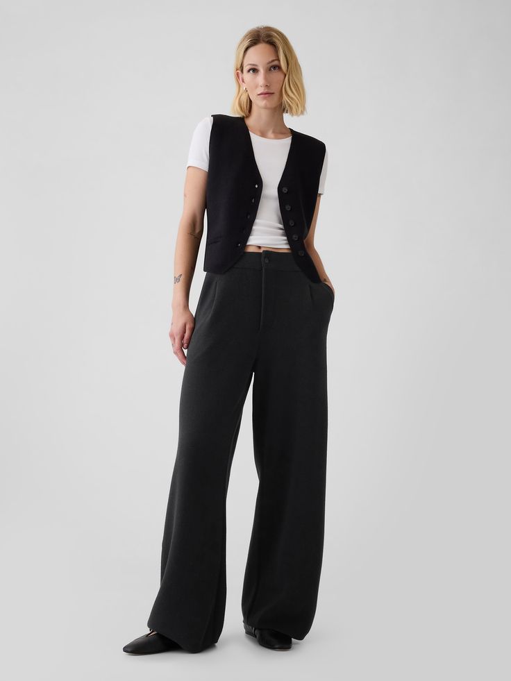 Supersoft cotton-blend sweater trousers.  Button closure, zip fly.  Front slant pockets.  Pleating at front.  This trouser is made with 25% recycled polyester.  Compared to virgin materials, using recycled materials helps to reduce resource use and waste.  Fit: Relaxed.  An easy silhouette throughout.  Models wearing Gap Hip Business Casual, Black Trouser Office Outfit, Avant Garde Office Wear, Punk Business Attire, Hip Hop Business Casual, Smart Business Casual Women Work Clothes, Nonbinary Office Fashion, All Black Outfit Business Casual, Modern Workwear Women