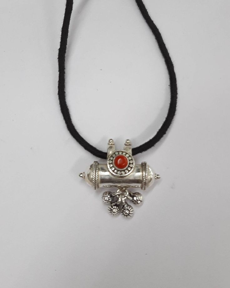 "Sterling Silver Pendant Necklace From Rajasthan India. Great Handmade Design adorn with red onyx gemstone, Good For Jewellery Collection. Taweez is considered as a carrier of lucky charm. One can keep any small item inside box. This doesnt interfere in day to day work. Can be worn as a pendant or also tied to the arm-band.They show their celestial properties when filled with mantras or materials obtained from puja rituals and ceremonies. They are tied on the arm or hanged round the neck. Pendan Good Luck Pendant Jewelry With Natural Stones, Good Luck Pendant With Natural Stones, Traditional Round Pendant Necklace For Good Luck, Good Luck Amulet Style Gemstone Jewelry, Spiritual Gemstone Necklace For Puja, Red Carnelian Spiritual Jewelry, Pendant Jewelry With Natural Stones For Rituals, Traditional Silver Carnelian Jewelry, Traditional Sterling Silver Jewelry For Good Luck