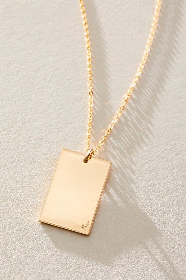 So unique in an understated design, this stunning necklace features a personalized rectangle pendant with initial engraved at corner for a super fun finishing touch. * 14k Gold Filled * 0.5x0.75" rectangle bar necklace with hand-stamped personalization * Length: 20" * 5 days of production | Set & Stones Personalized ie Necklace at Free People in Gold Sterling Silver Rectangular Necklace For Personalized Gift, Minimalist Rectangular Pendant Initial Necklace, Rectangular Sterling Silver Necklace, Elegant Silver Rectangular Bar Necklace, Minimalist Personalized Initial Necklace, Minimalist Rectangular Pendant Necklace With Engraving Option, Minimalist Square Pendant Initial Necklace, Minimalist Everyday Initial Necklace With Square Pendant, Sterling Silver Rectangular Jewelry For Personalized Gifts