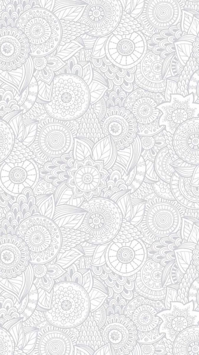 a white wallpaper with an intricate design on it's side and the background is very