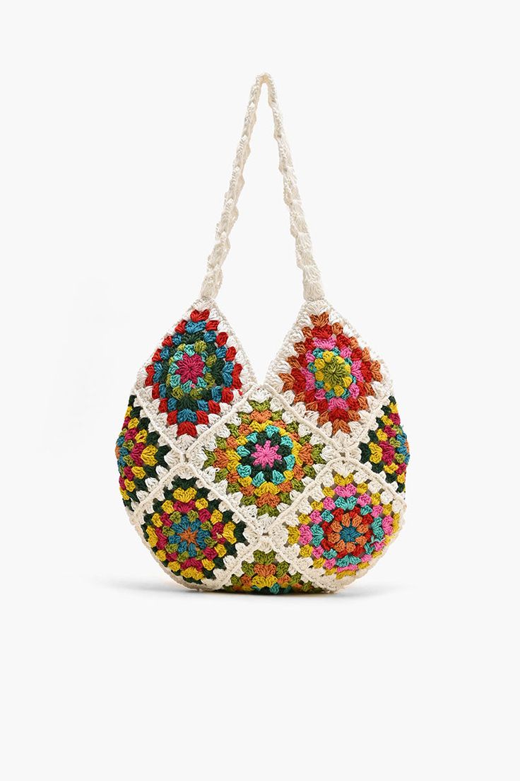 Shoulder bag Crochet Top Handle Colorful floral patchwork from front to back Magnetic button closure Lined interiors with zip pocket Size: 13.5" x 12.5" Embrace your free-spirited style and make a statement with this bohemian-inspired bag that's as practical as it is stylish. The Slouchy Crochet Shoulder Bag is a bohemian-inspired accessory that effortlessly combines style and functionality. Crafted with care and attention to detail, this shoulder bag is perfect for those who appreciate unique a Multicolor Patchwork Hobo Bag For Everyday Use, Multicolor Patchwork Hobo Bag For Daily Use, Daily Use Multicolor Patchwork Hobo Bag, Casual Multicolor Patchwork Hobo Bag, Bohemian Shoulder Bag For Spring, Bohemian Style Shoulder Bag For Spring, Bohemian Square Bags For Vacation, Hippie Multicolor Patchwork Bag, Summer Multicolor Patchwork Bag