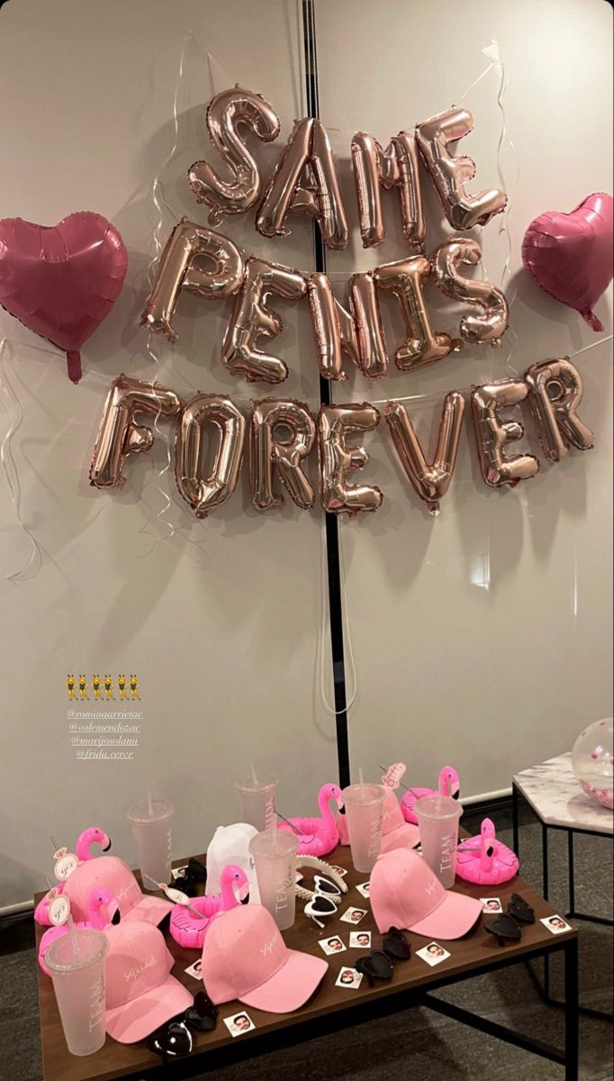 a table with some pink items on it and balloons that say save the date forever