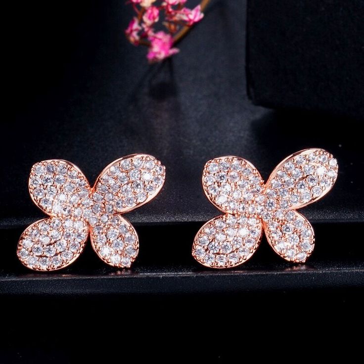 Delicate but oh, so sparkly! The entire surface of the earrings is studded with flawlessly faceted cubic zirconia stones that capture the light in a dazzling array of sparkles. The earrings are rose gold / rhodium plated for a bright finish which enhances the intricate detailing and conveys a modern take on old elegance. Length: 1.2" (approx. 3cm). Width: 0.8" (approx. 2.2cm). Weight: 4g. Available in Rose Gold and Silver finishes. To make your choice select your preferred finish from the dropdo Glamorous Cubic Zirconia Diamond Earrings With Sparkling Stones, Glamorous Diamond Earrings With Sparkling Stones, Elegant Rose Gold Cluster Earrings With Cubic Zirconia, Glamorous Rose Gold Cubic Zirconia Crystal Earrings, Rose Gold Bridal Earrings With Sparkling Cubic Zirconia, Glamorous Rose Gold Crystal Earrings With Cubic Zirconia, Elegant Rose Gold Cubic Zirconia Cluster Earrings, Rose Gold Crystal Earrings For Party, Dazzling Diamond White Crystal Earrings With Sparkling Stones