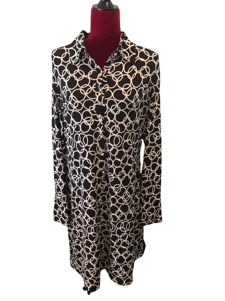 This is a beautiful International Concepts dress. It is Black with white circulars. It has seven gold buttons in front, a turn down collar, long sleeves with two gold buttons on the end of each. This is a lovely knee length dress made of 95% polyester and 5% spandex. The dress is a size XLarge and has a stretch to it. Bust: 42” (has stretch) Waist: 38” (has stretch) Sleeves: 25” Dress Length: 38” Gold Long Sleeve Dress For Work, Long Sleeve Gold Dress For Work, Chic Long Sleeve Midi Dress With Covered Buttons, Elegant Long Sleeve Shirt Dress With Buttons, Elegant Long Sleeve Buttoned Shirt Dress, Chic Gold Long Sleeve Midi Dress, Gold Long-sleeved Dress For Work, Gold Buttons, Knee Length Dress