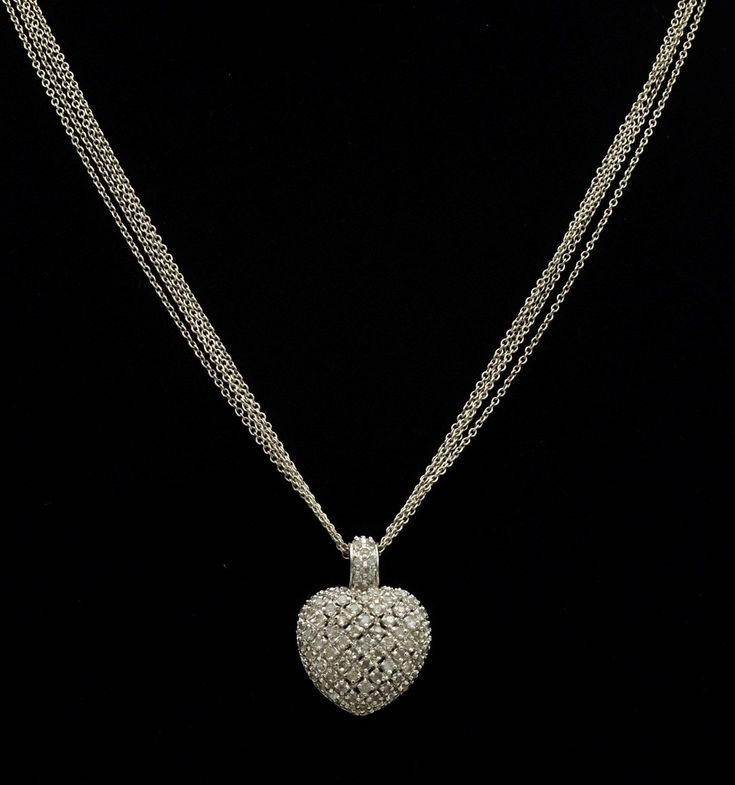 Sterling silver and diamond heart necklace. At the end of the 18 inch sterling chain hangs a 1 inch heart pendant set with small diamonds throughout. The perfect gift to tell that special someone how you feel! Each piece has been hand selected and meticulously identified and graded by a Graduate Gemologist who has been awarded a degree by the Gemological Institute of America (GIA). Please visit our Shop's About Page or our website for more information about our jewelry. If you have any questions Silver Diamond Pendant Necklace For Valentine's Day, Formal Silver Heart-shaped Diamond Necklace, Silver Diamond Necklace With Accents For Valentine's Day, Silver Diamond Necklace For Valentine's Day, Silver Diamond Necklace For Valentine's Day Formal, Silver Diamond Necklace For Formal Valentine's Day, Silver Heart Necklace With Diamond Accents For Formal Occasions, Silver Diamond Necklace With Heart Charm For Valentine's Day, Valentine's Day Silver Diamond Necklace With Heart Charm