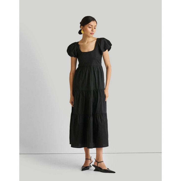 Step into effortless elegance with our Puff Sleeve Tiered Maxi Dress. This beautiful dress has delicate tiers that exude charm and sophistication. With it's puffed sleeves, this maxi-length dress features a fitted bodice and a flattering flare from the waist down. The elasticated back, coupled with a convenient side zipper, ensures a comfortable yet perfect fit. Crafted for both style and convenience, this dress also offers practicality with pockets on both sides. Elevate your wardrobe with this maxi dress, perfect for various occasions from daytime chic to evening allure. Feminine Puff Sleeve Maxi Dress With Ruffles, Puff Sleeve Maxi Dress With Gathered Sleeves, Chic Puff Sleeve Maxi Dress With Gathered Sleeves, Chic Maxi Puff Sleeve Dress With Gathered Sleeves, Chic Maxi Length Puff Sleeve Dress With Gathered Sleeves, Chic Voluminous Maxi Dress With Puff Sleeves, Elegant Voluminous Puff Sleeve Dress For Daywear, Tiered Maxi Dress With Gathered Sleeves, Chic Voluminous Midi Dress For Daywear