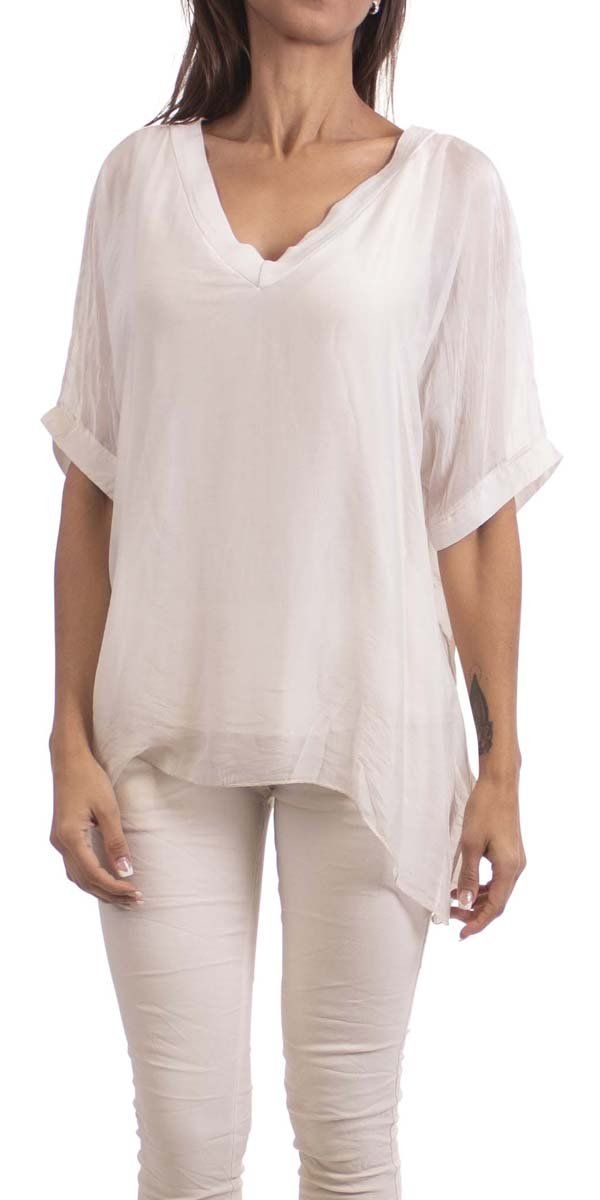 Gentle flowing pure silk, double V-neck silk blouse. Short sleeve finished with wide double-layer hem. Exterior 100% Silk | Interior 95% Viscose, 5% Elastic Model 5'8" One Size Made in Italy Versatile V-neck Viscose Blouse, Solid V-neck Viscose Blouse, Solid V-neck Blouse For Layering, Elegant Silk V-neck Tunic, Spring Blouse For Layering With Shirttail Hem, Summer Viscose Tunic Top, Flowy Solid V-neck Blouse, Flowy Solid Color V-neck Blouse, Silk Blouse For Summer Layering