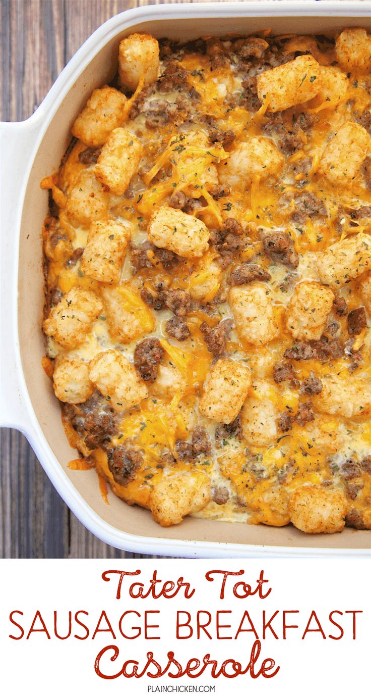 tater tot sausage breakfast casserole in a white dish on a wooden table