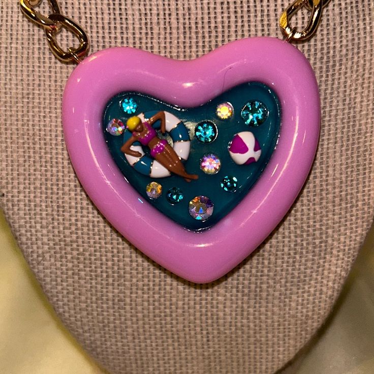 Betsey Johnson Heart Shape Pool Pink Heart Necklace For Valentine's Day Party, Playful Pink Necklace For Valentine's Day, Purple Heart Shaped Necklace For Party, Playful Pink Jewelry With Heart Charm, Pink Heart Necklace For Party, Playful Pink Heart Necklaces, Playful Pink Heart-shaped Necklaces, Whimsical Heart Shaped Necklace With Heart Charm, Handmade Pink Heart Necklace