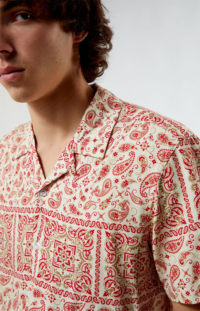 Elevate your summer style with the Red Paisley Camp Shirt from PacSun. Featuring a classic collared neckline and short sleeves, it offers a comfortable regular fit perfect for laid-back days. Complete with button closures and a vibrant paisley print throughout, this shirt adds a touch of retro flair to any outfit.


	Collared neckline
	Short sleeves
	Standard fit
	Button closures
	Paisley print throughout
	Model is wearing size medium Shirt Outfit Men, Paisley Fashion, Paisley Shirt, Half Shirts, Red Paisley, Retro Men, Camp Shirt, Camping Shirt, Festival Wear