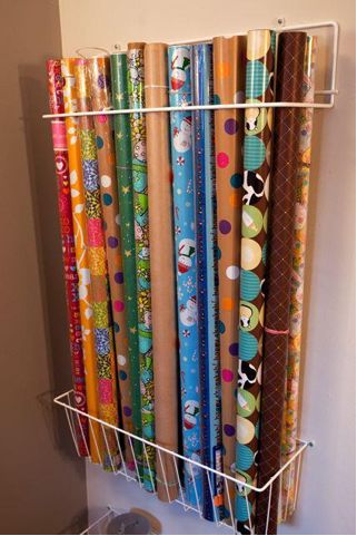 several rolls of wrapping paper are hanging on the wall