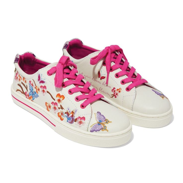 Our best-loved shoe silhouette - a soft leather lace-up sneaker - takes a new direction with inspiration from our designer's journey to Kyoto, Japan, famous for its spectacular displays of cherry blossoms in the spring. Optic white printable tumbled leather is the perfect backdrop to bold embroidery with a colorful cherry blossom scene accented with butterflies. A definite conversation-starter! Flower Painter Tennis Shoes, Cherry Blossom Shoes, Shoe Silhouette, Embroidered Sneakers, Famous Footwear, Kyoto Japan, Painted Shoes, New Directions, Cherry Blossoms