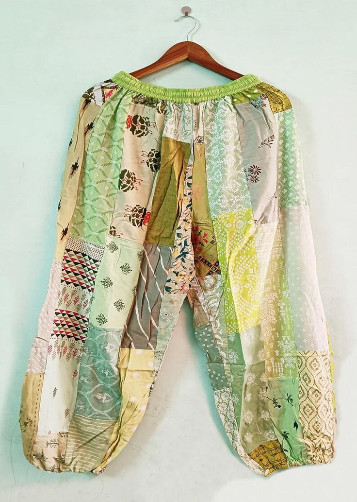 "Women's Summer Pants, Patchwork Harem Pants with Pockets, Hippie Boho Rayon Harem Pants, Festival Clothing These patchwork trousers are really lightweight and comfortable because they are produced by hand from soft Rayon! You can wear these trousers to all of your outdoor activities throughout spring and summer. These trendy and cosy trousers are great for festivals, picnics, bonfires and just lounging around the house! Item: Indian Handmade Patchwork Pant  Color: Multicolor ( As Picture ) Measurements: Size: Waist 24-40\" inches  Lenght: 39\" inches Inseam: 27\" inche Elastic drawstring as a closure type NOTE: A unique design could be very. bottom of the pants to the top These trousers can fit people of different sizes thanks to the scrunch waist. NOTE: Due to photography lighting source Heram Pants, Patchwork Trousers, Patchwork Pants, Summer Pants Women, Harem Pant, Rayon Pants, Summer Pants, Festival Outfits, Urban Fashion